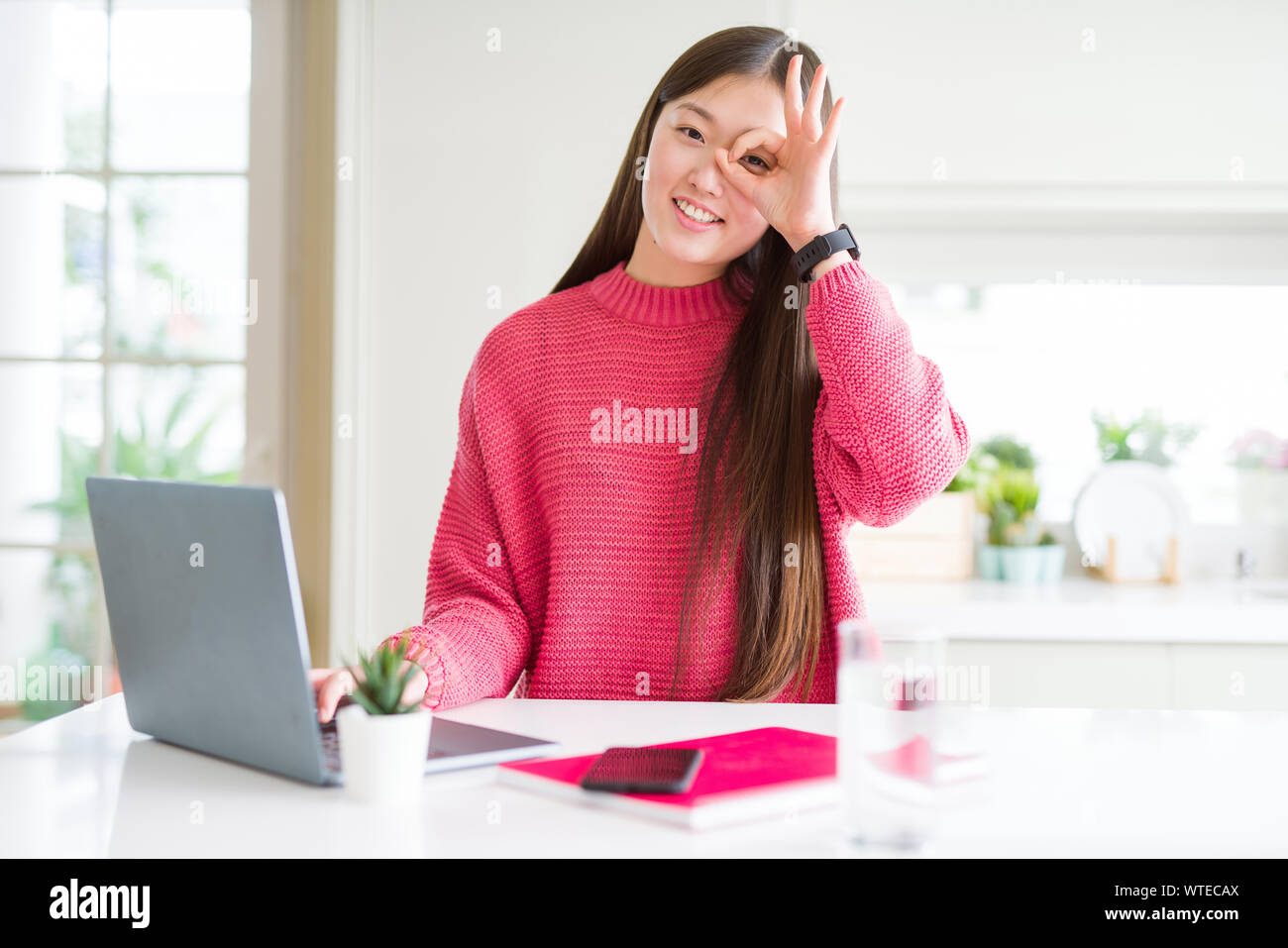 Beautiful Asian woman working using computer laptop with happy face ...
