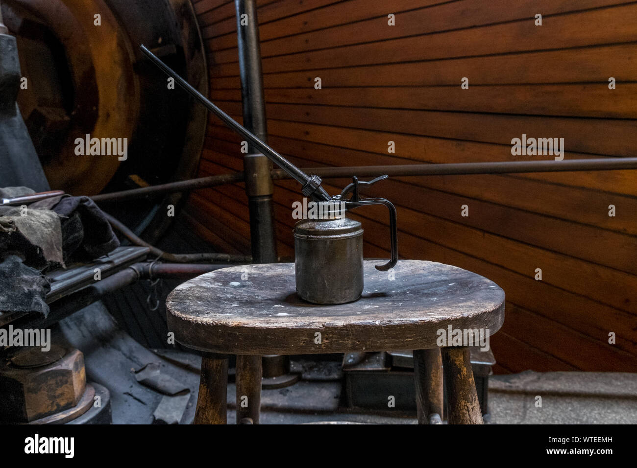 Oil can in engineers workshop. Stock Photo