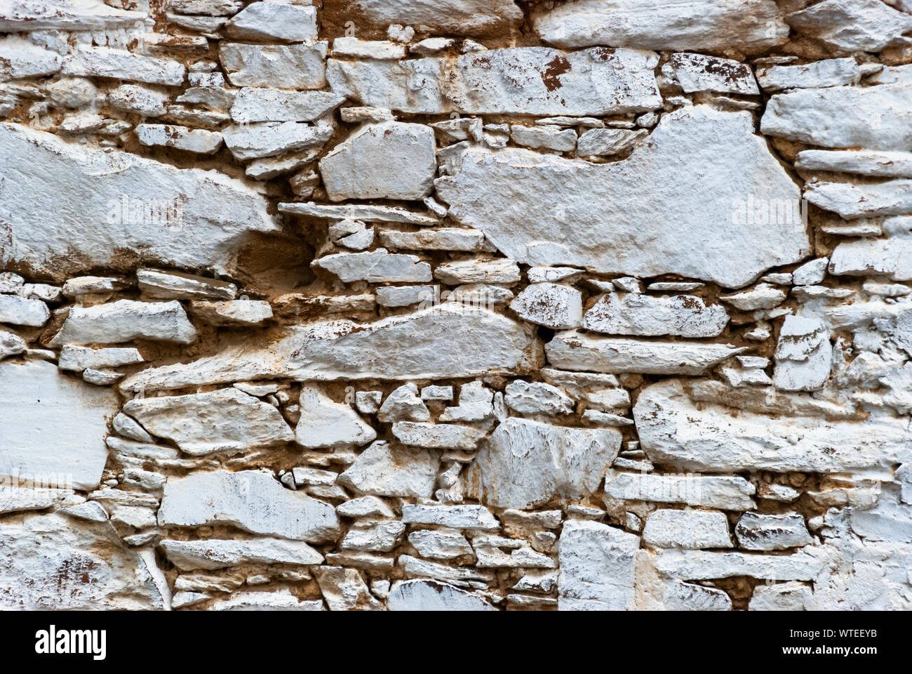 Weathered stone painted wall texture from Turkey. Wallpaper. Stock Photo