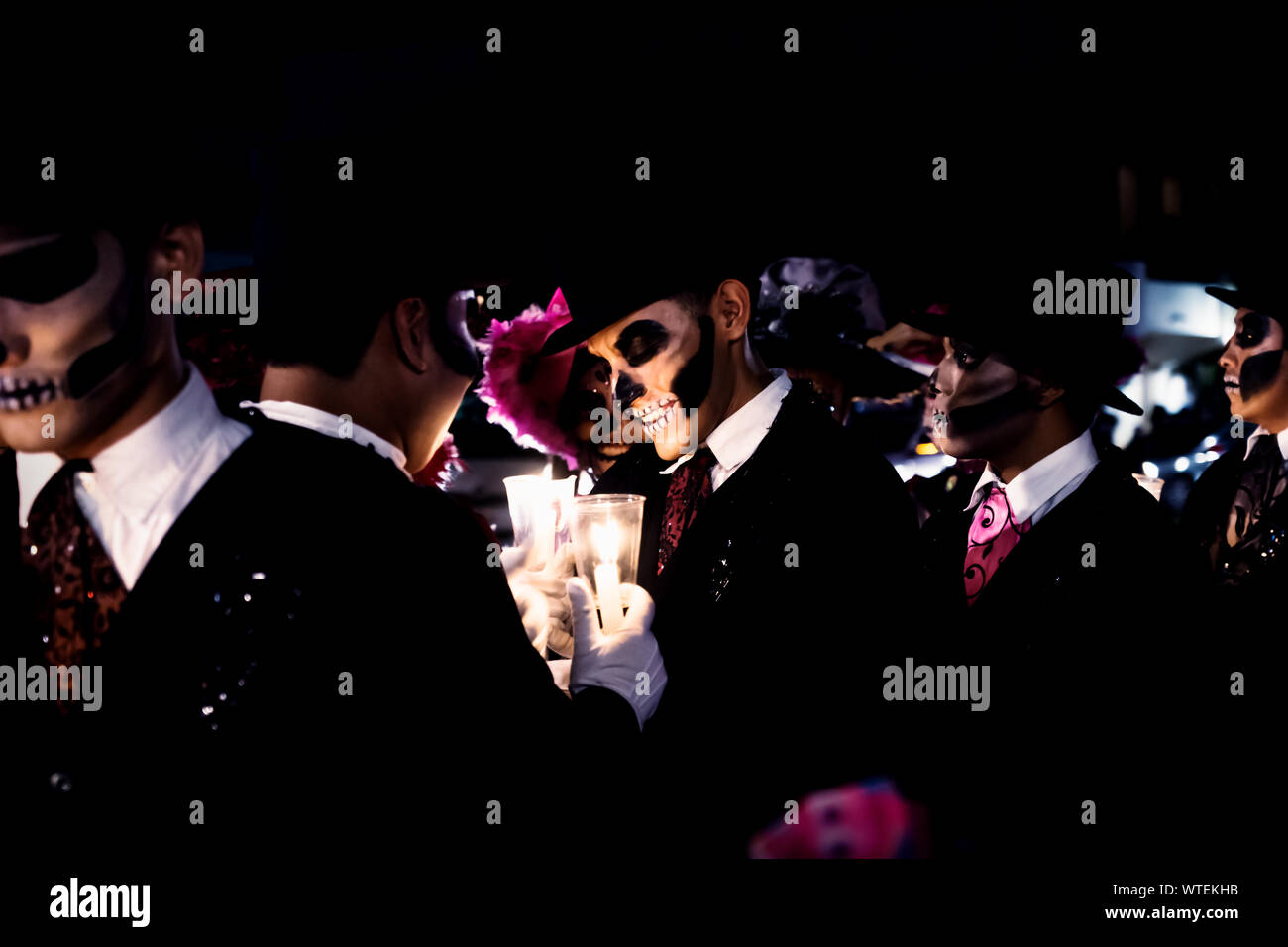 Merida, Mexico - October 27 2018: Dancers waiting for the parade and lightening candels for Dias de las muertos at Remate de Paseo Montejo at Festival de las Animas, Merida, Mexico Stock Photo