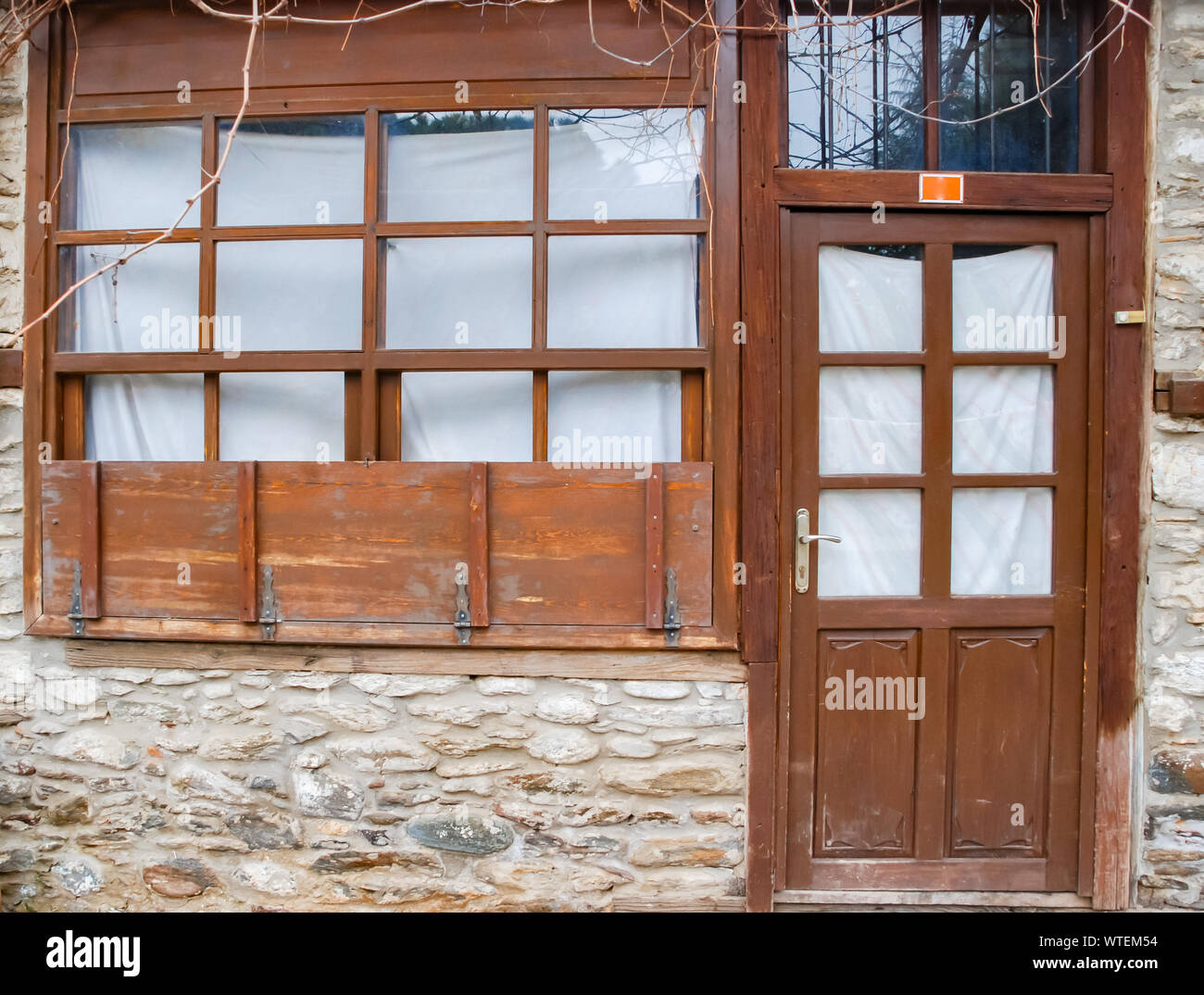wooden door and window on facade of old country house. background Stock ...