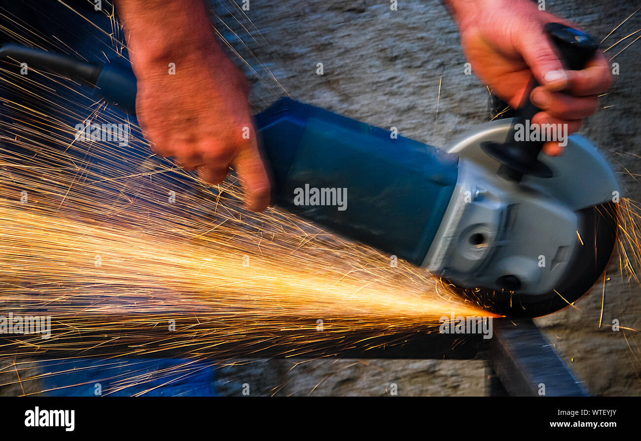 Man using grinding machine hires stock photography and images Alamy