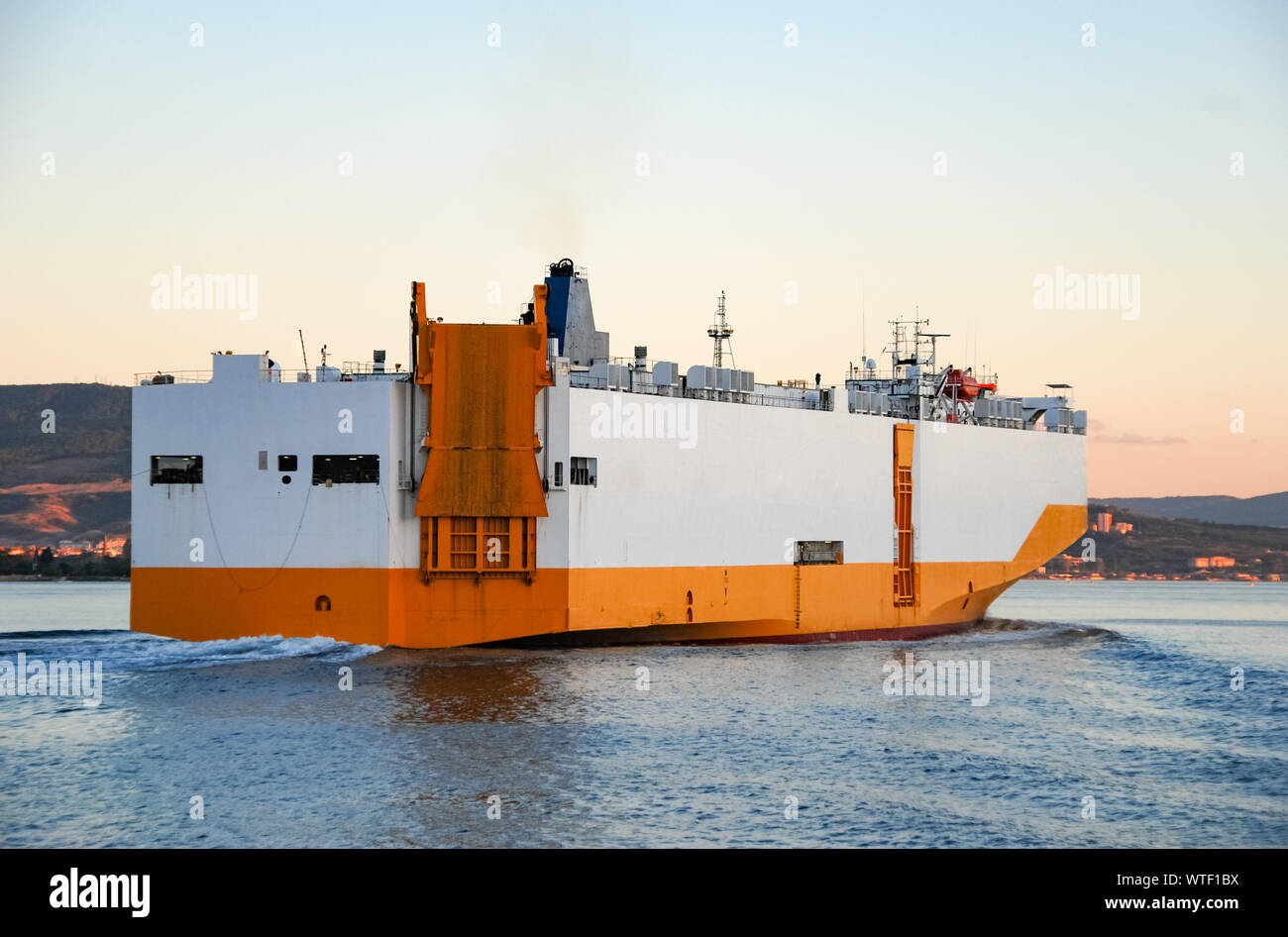 Large Roll-on roll-off RORO or ro-ro ship or oceangoing vehicle carrier  ship sailing in the sea. Roro ship designed to carry wheeled cargo such as  car Stock Photo - Alamy