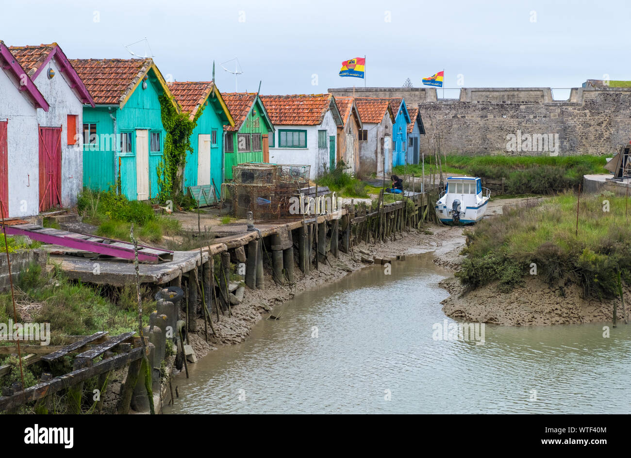 Ile d'Oleron, France - May 10, 2019: Colorful huts of fishermen in Le Chateau-d'Oleron on Ile d'Oleron in France Stock Photo