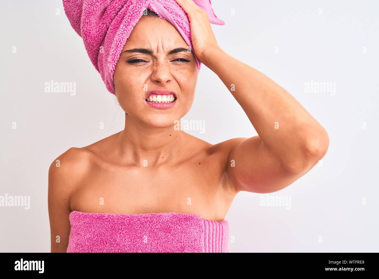 Young Beautiful Woman Wearing Shower Towel After Bath Over Isolated White Background Stressed 