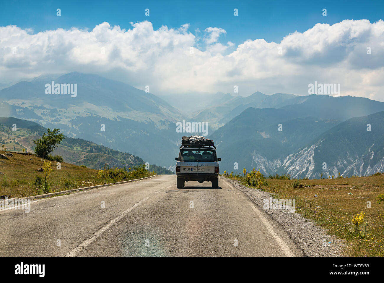 Kolesjan, Albania - July 25, 2019. Vintage off road car heading to the mountain in National Park LureKolesjan, Albania - July 25, 2019. Vintage off ro Stock Photo