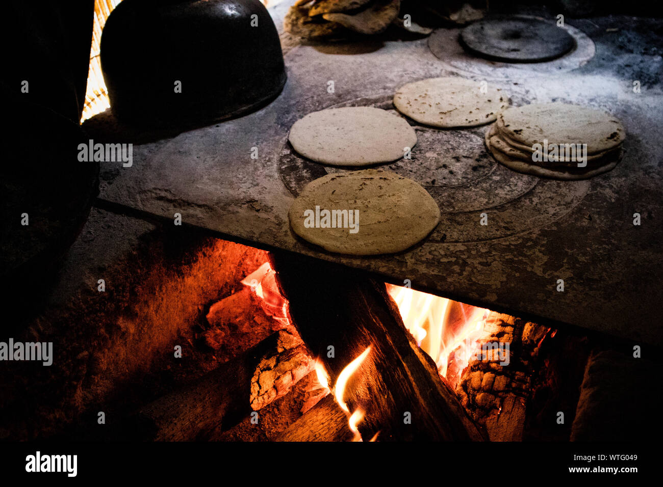 Nutritious Handmade Corn Tortilla Cooked On A Metal Griddle On A Gas Stove  In A Guatemalan Home Stock Photo - Download Image Now - iStock