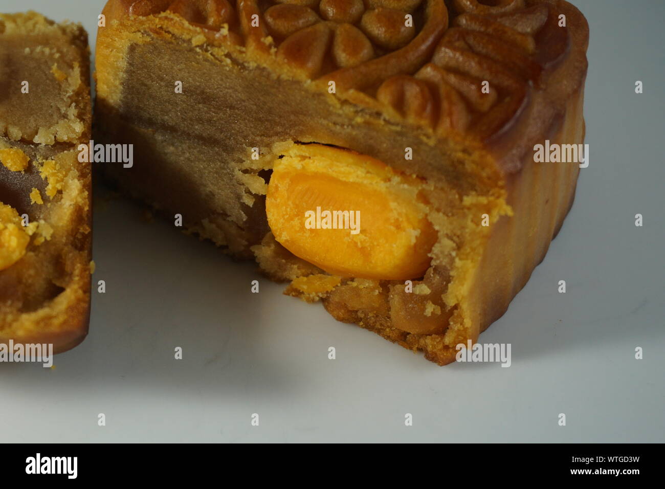 Double egg yolk and lotus seed paste moon cakes for Mid-Autumn Festival celebrated in Chinese culture. Stock Photo