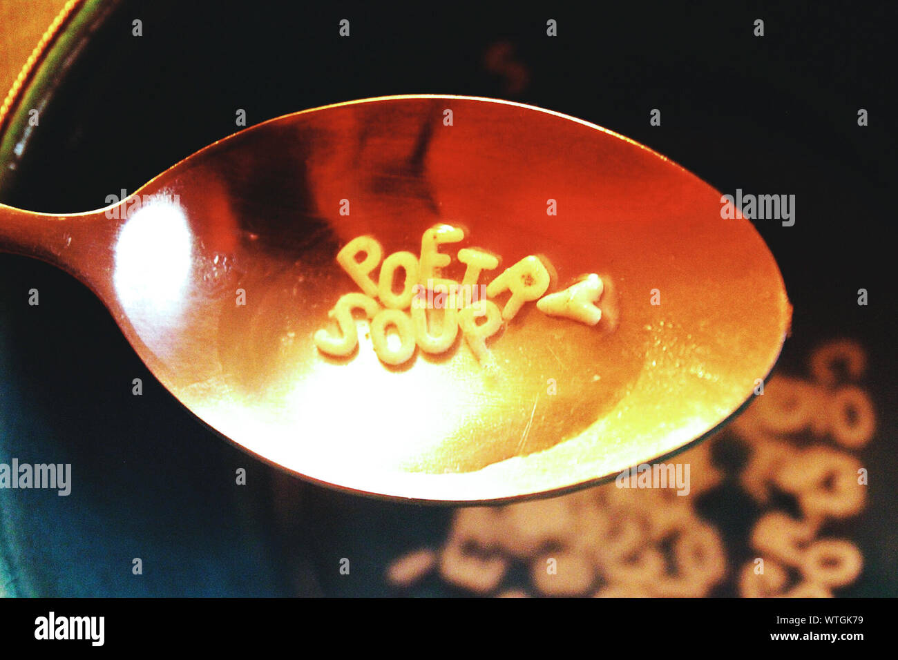 High Angle View Of Alphabet Soup In Spoon Stock Photo