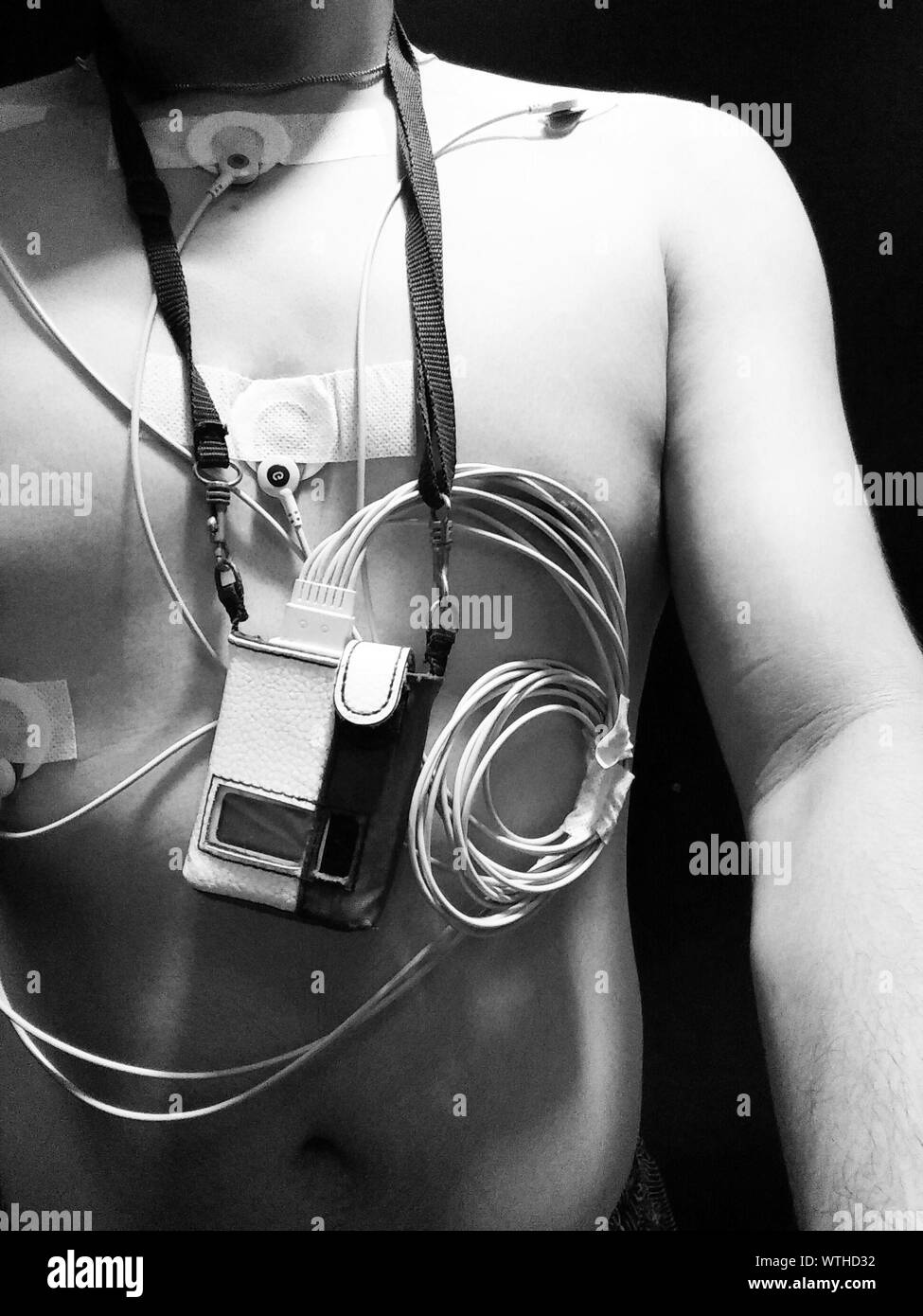 Midsection Of Man With Electrodes Attached On Body Stock Photo