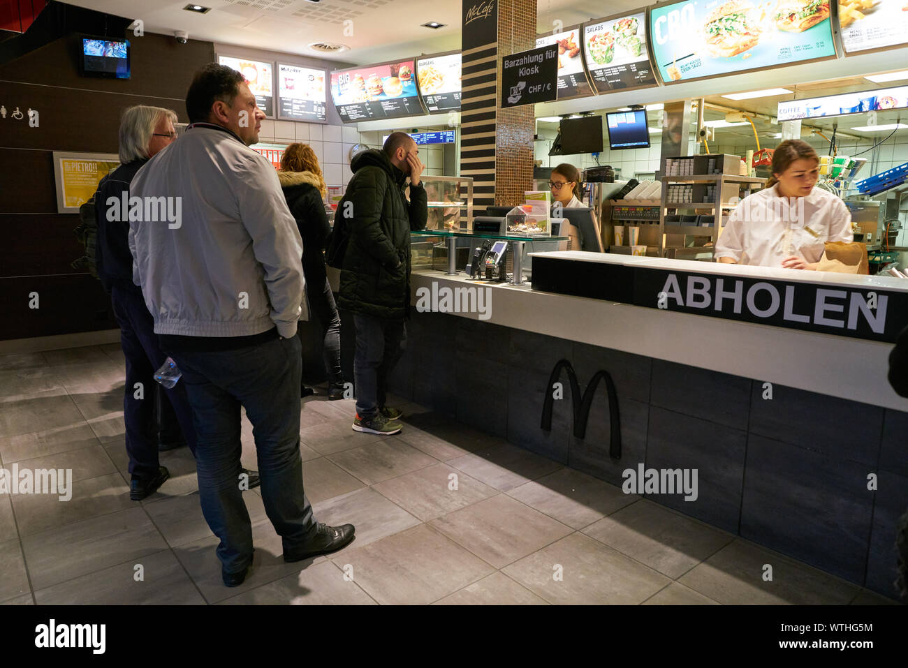 ZURICH, SWITZERLAND CIRCA OCTOBER, 2018 people queue at McDonald's