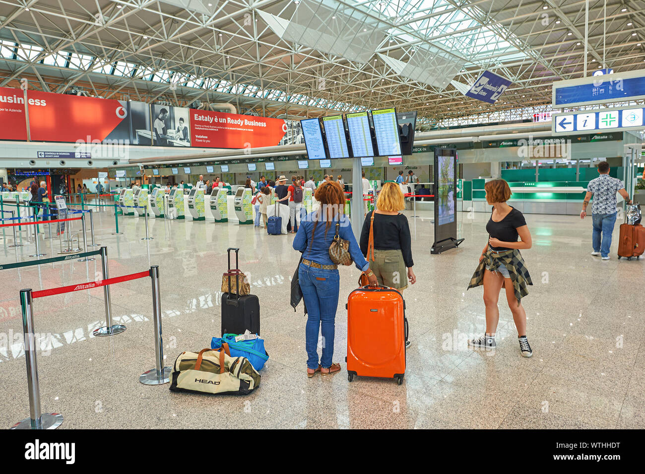 ROME, ITALY - CIRCA AUGUST, 2015: people at check-in area in Rome - Fiumicino International Airport 'Leonardo da Vinci'. Stock Photo