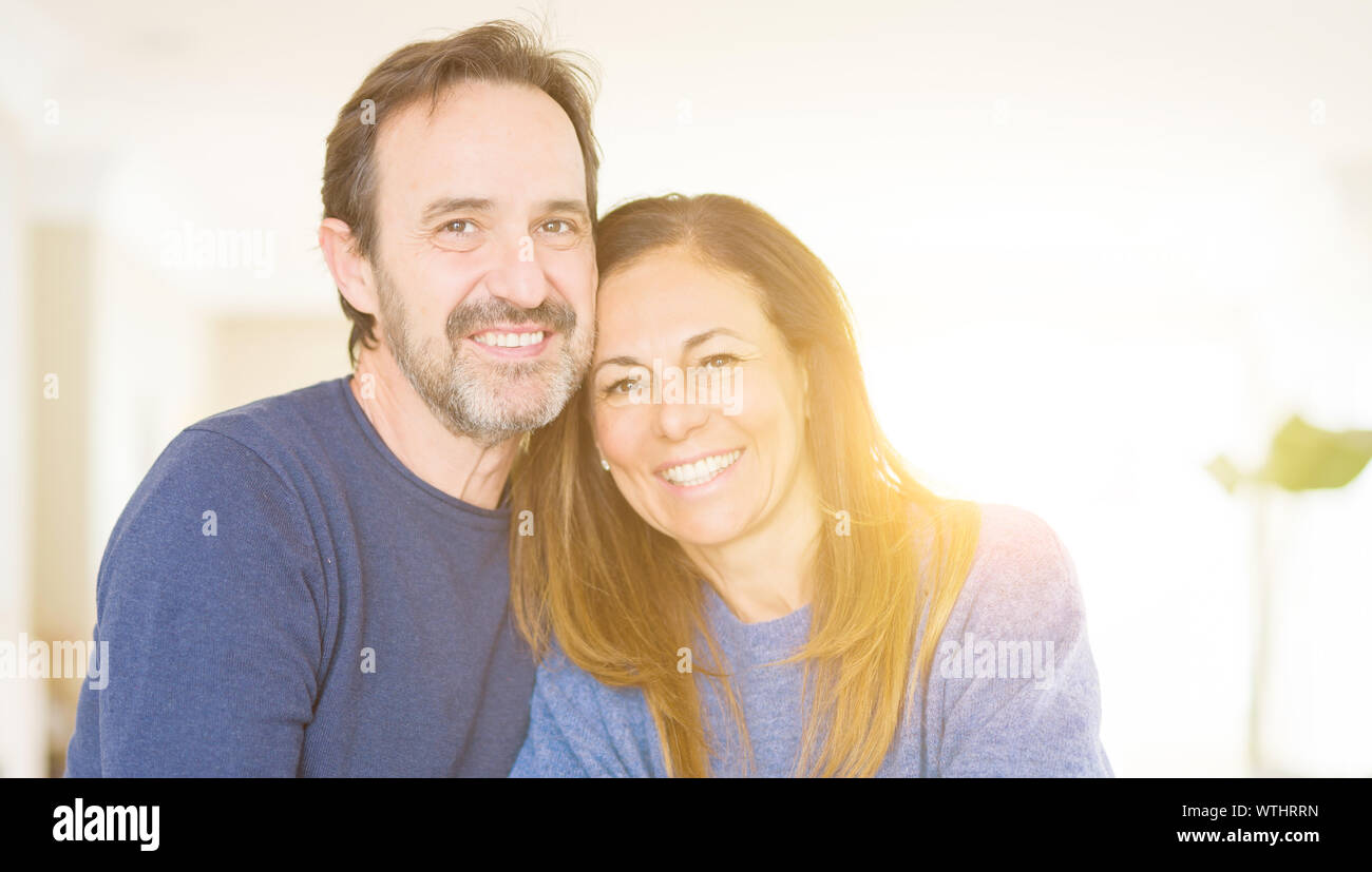 Romantic middle age couple sitting together at home Stock Photo - Alamy