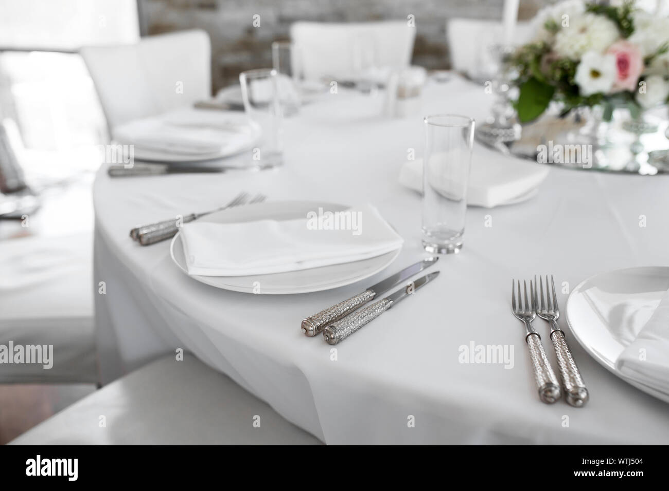 Wedding Table Setting Decorated With Fresh Flowers White Plates