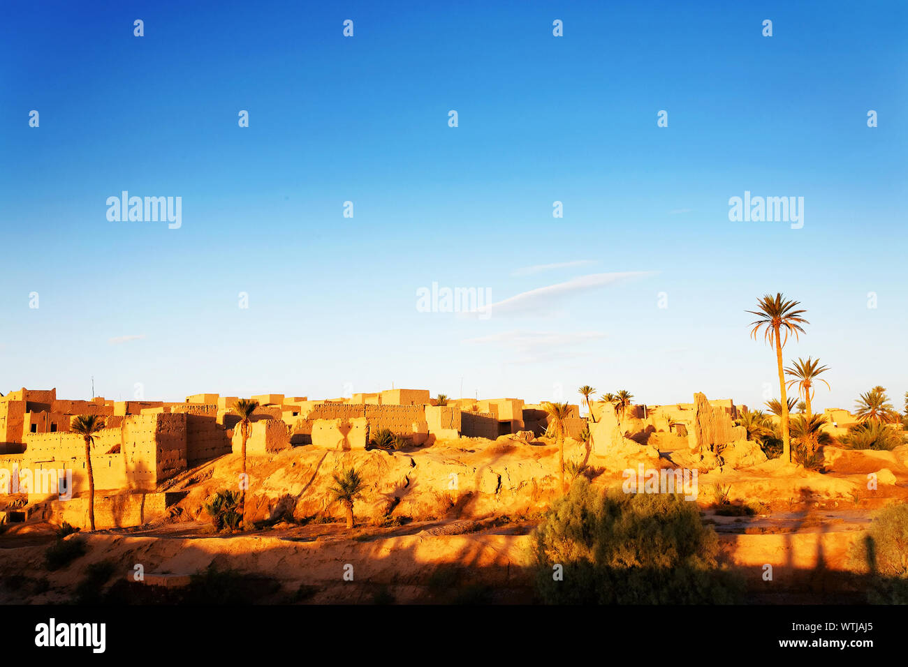 Townscape At Erg Chebbi Desert Against Sky Stock Photo