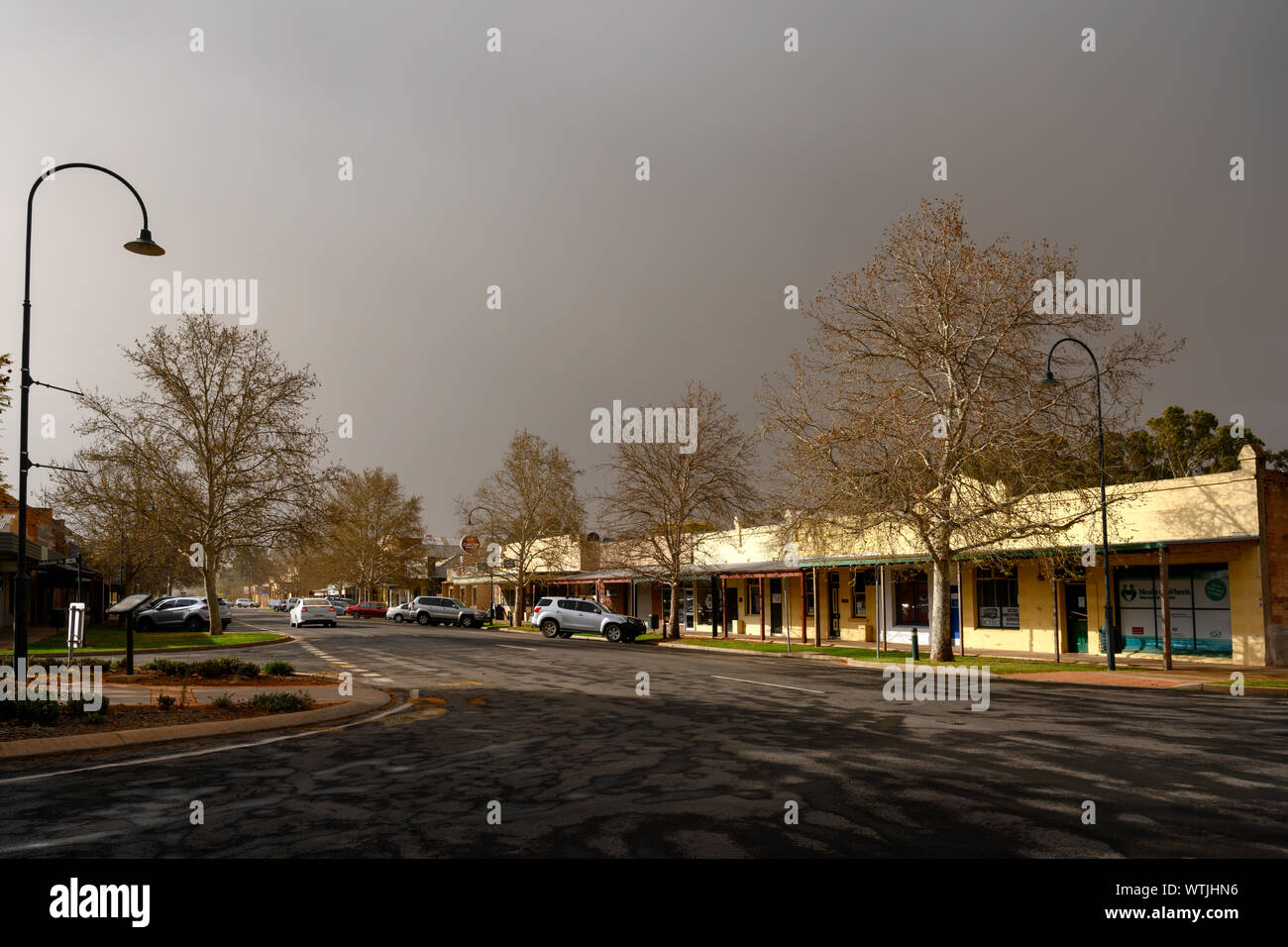 Late light on buildings in the main street of a small rural town in Australia. Just after a small shower of rain on an otherwise very dusty day. Stock Photo