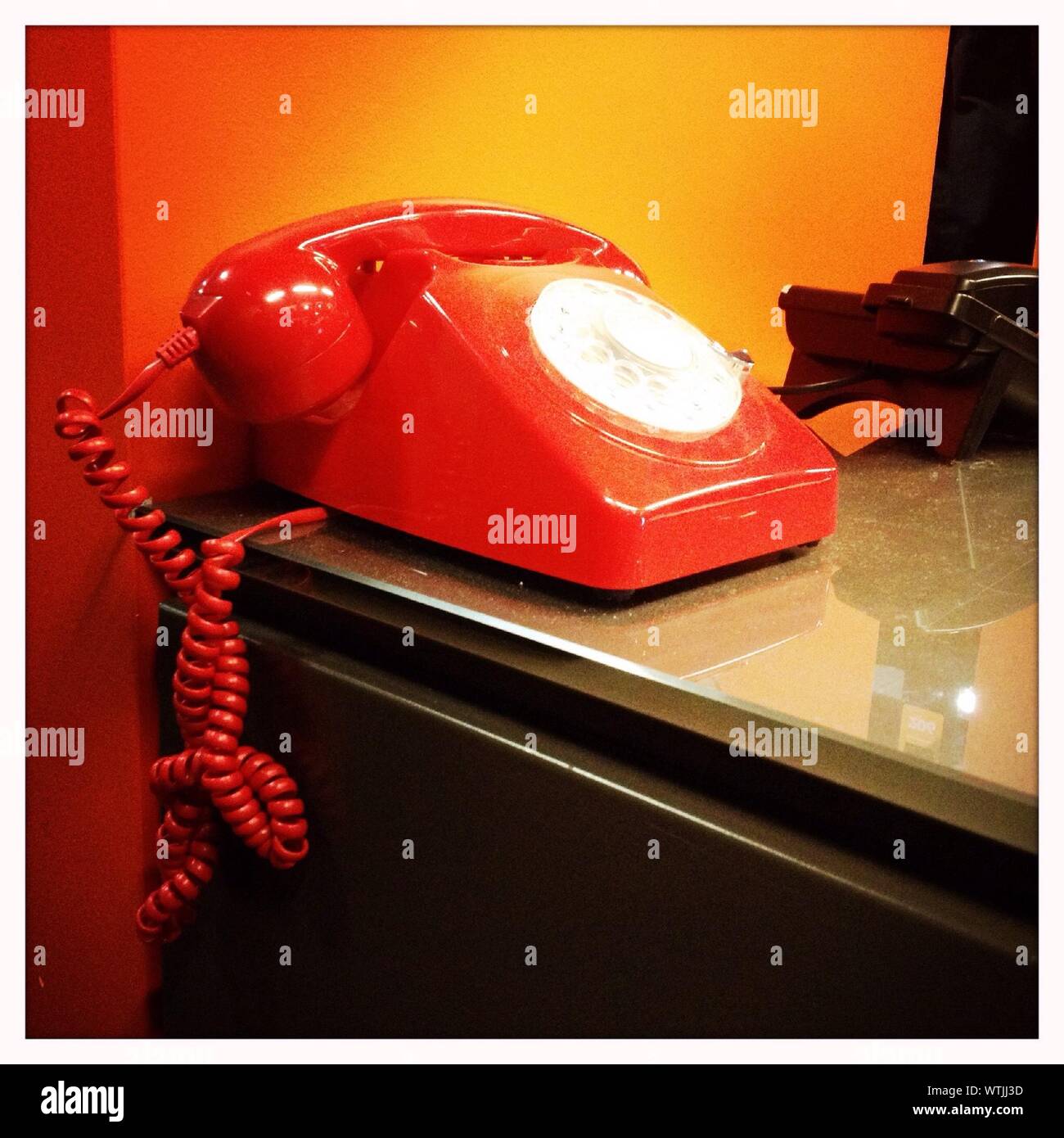 Oldfashioned Telephone On Table At Home Stock Photo Alamy