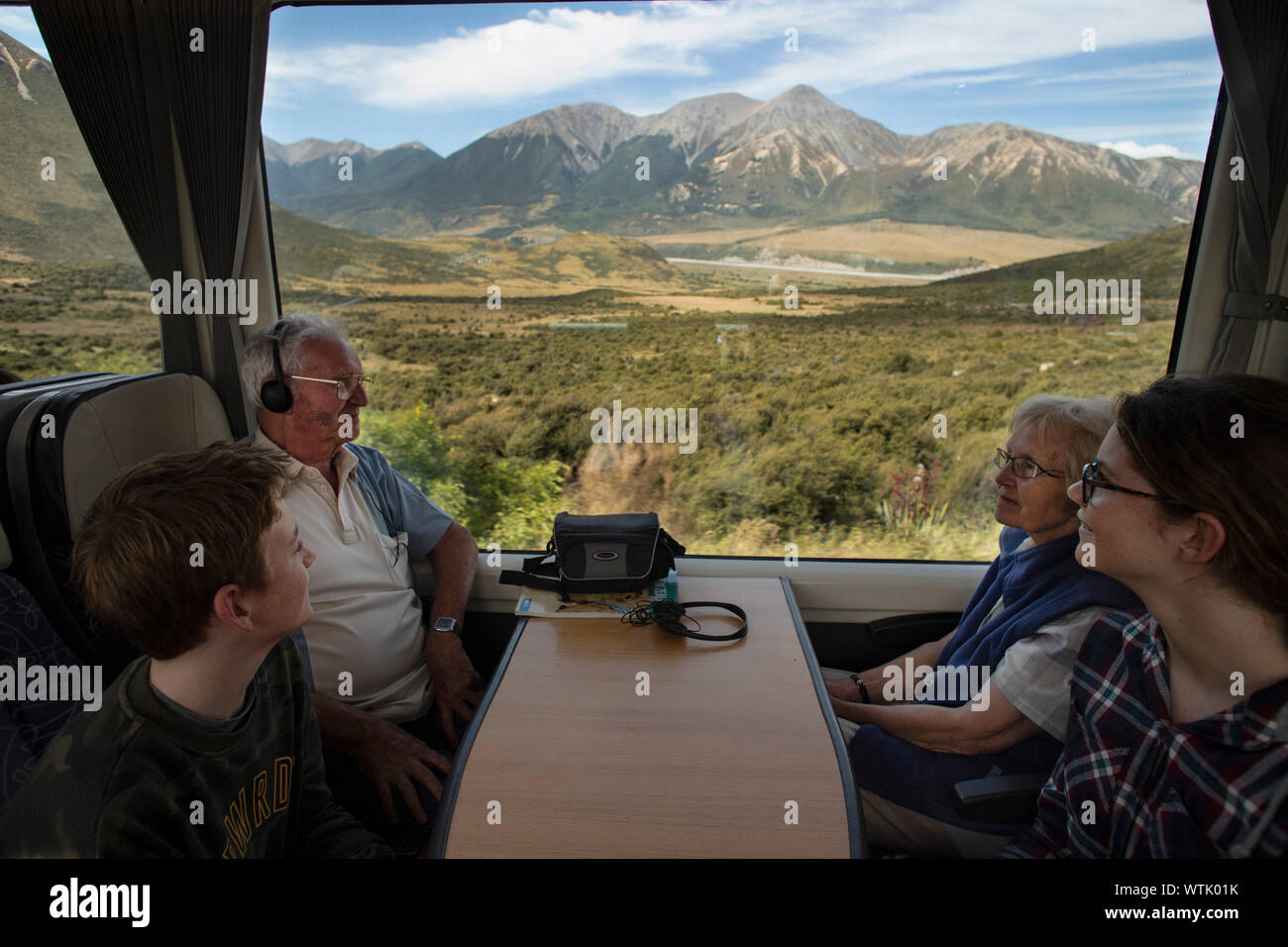 Picture by Tim Cuff - 4 January 2019 - Tranz Alpine train journey from Greymouth to Christchurch, New Zealand: two children and their grandparents enj Stock Photo