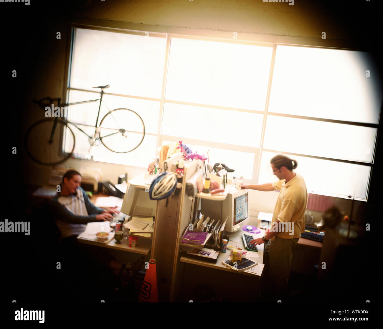 Two men engrossed in their work at office. Stock Photo