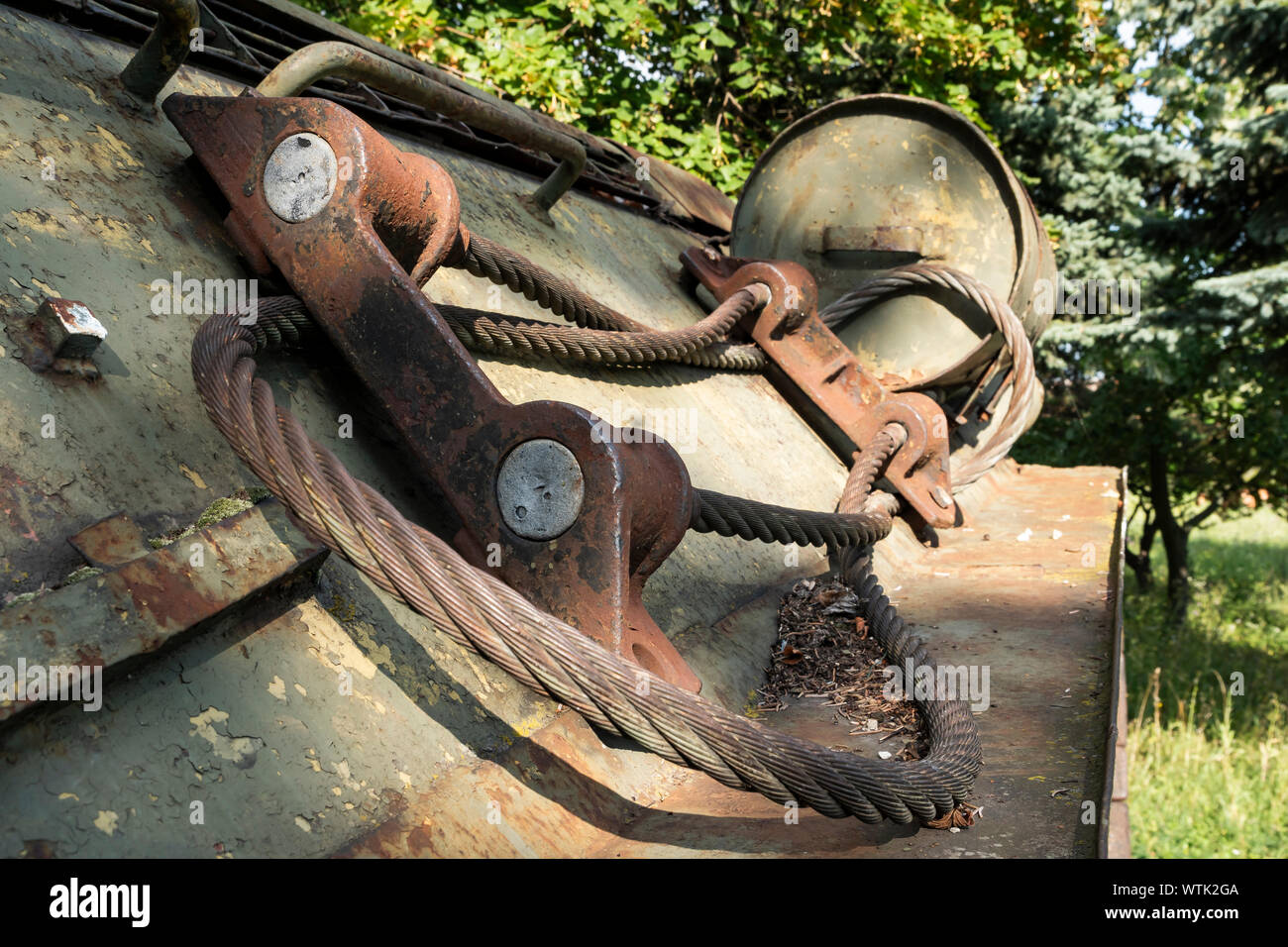 Side of a rusty Soviet T-34 tank with a steel Wire in Dargov, Slovakia, Europe in Dargov, Slovakia, Europe Stock Photo
