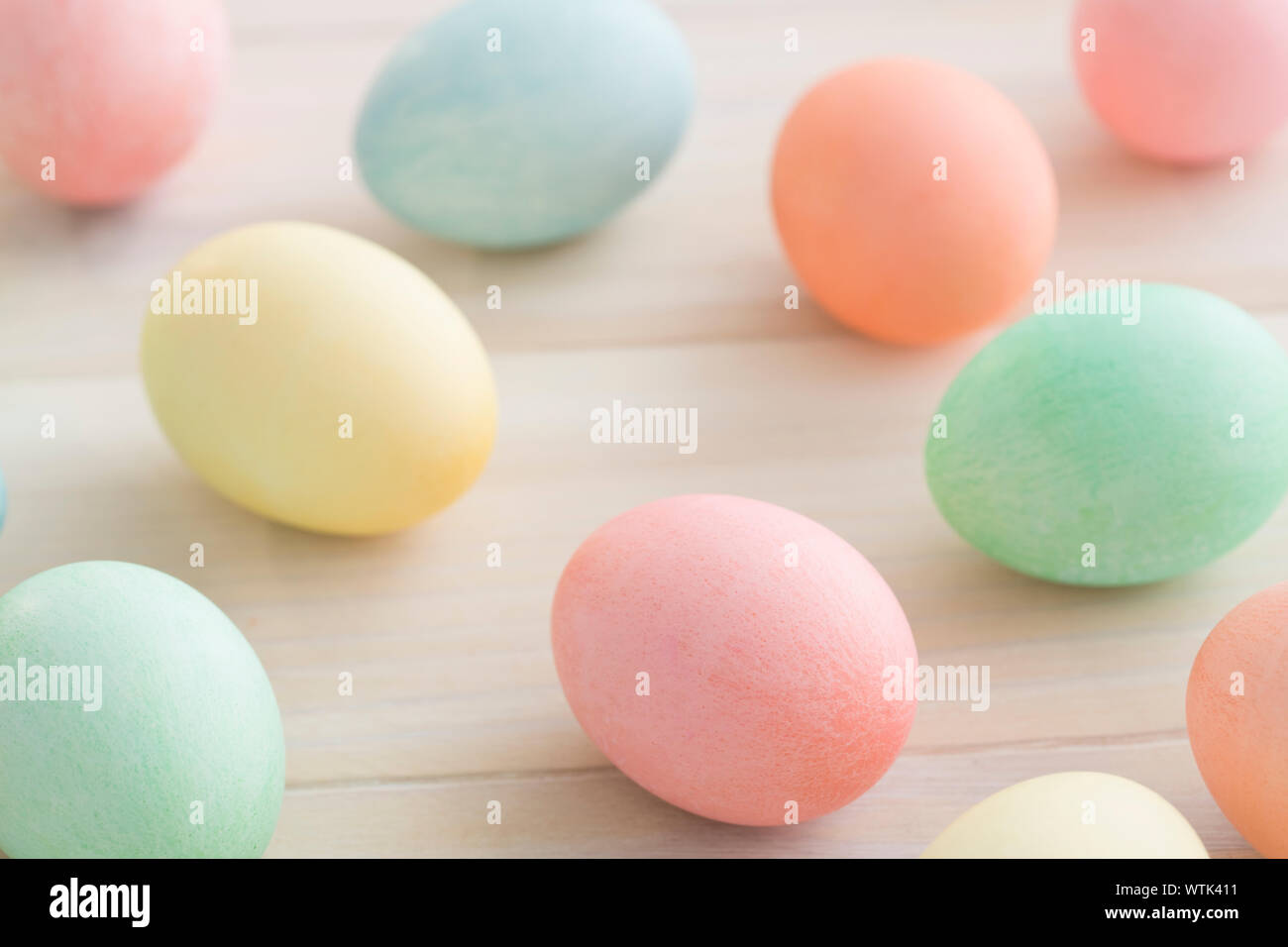 Pastel colored Easter eggs on table Stock Photo