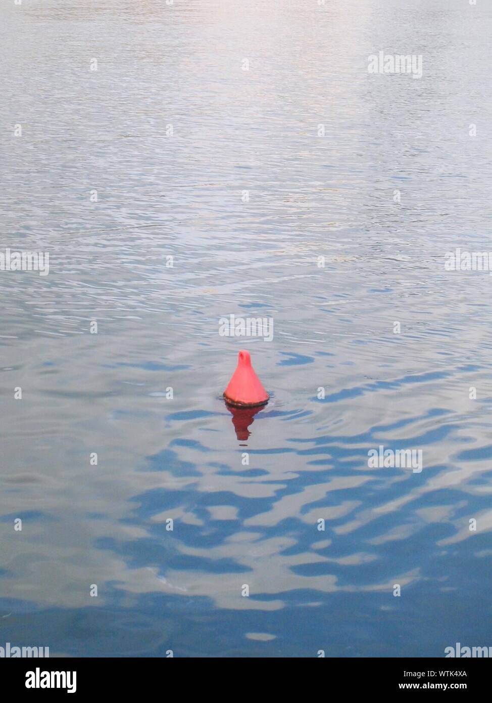 Red Buoy Floating On Water Stock Photo - Alamy