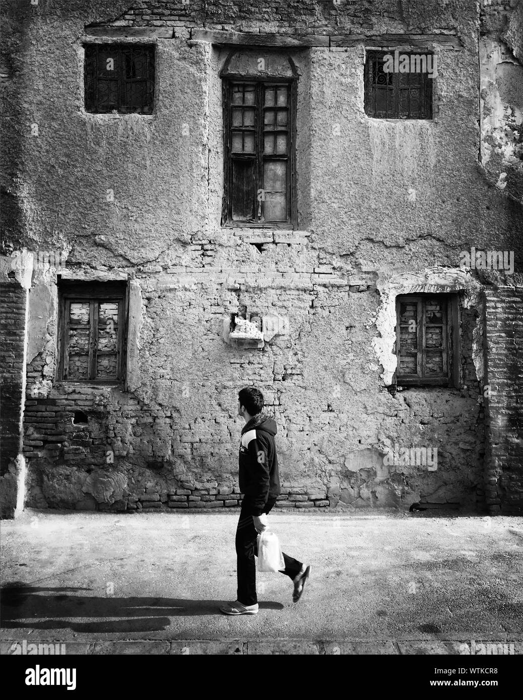 Man Walking Side View Sunlight Black and White Stock Photos & Images ...