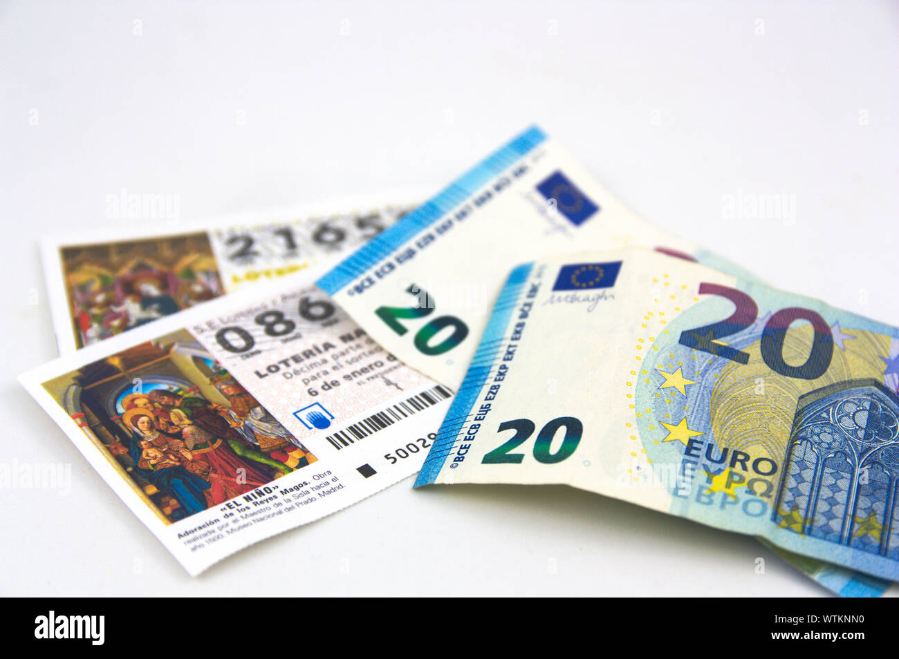 2019. Spain. Some euro bills on some tickets for the draw for the national Christmas lottery. Stock Photo