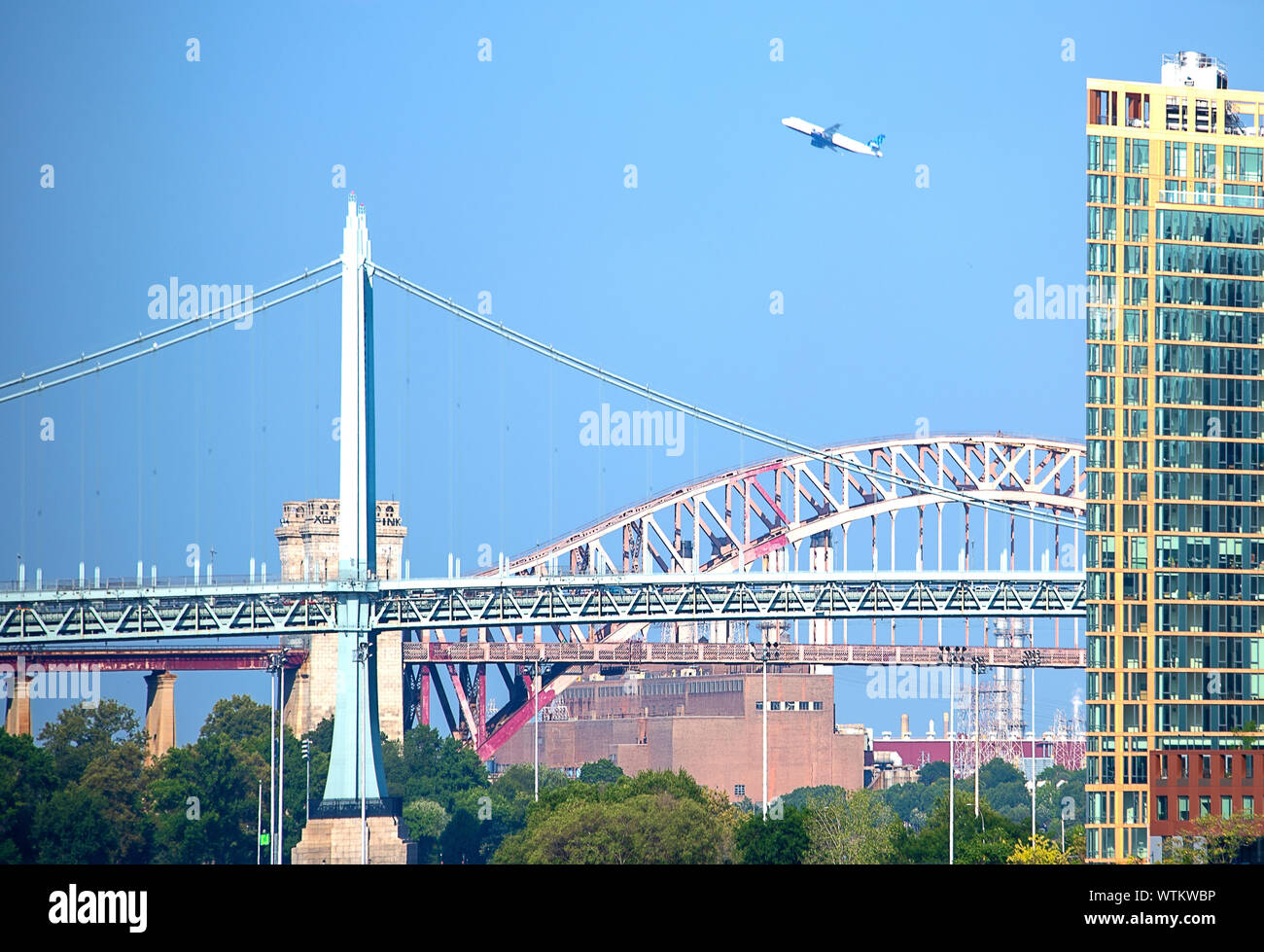 Bridges Of New York, an airplane taking off from LaGuardia Airport Stock Photo
