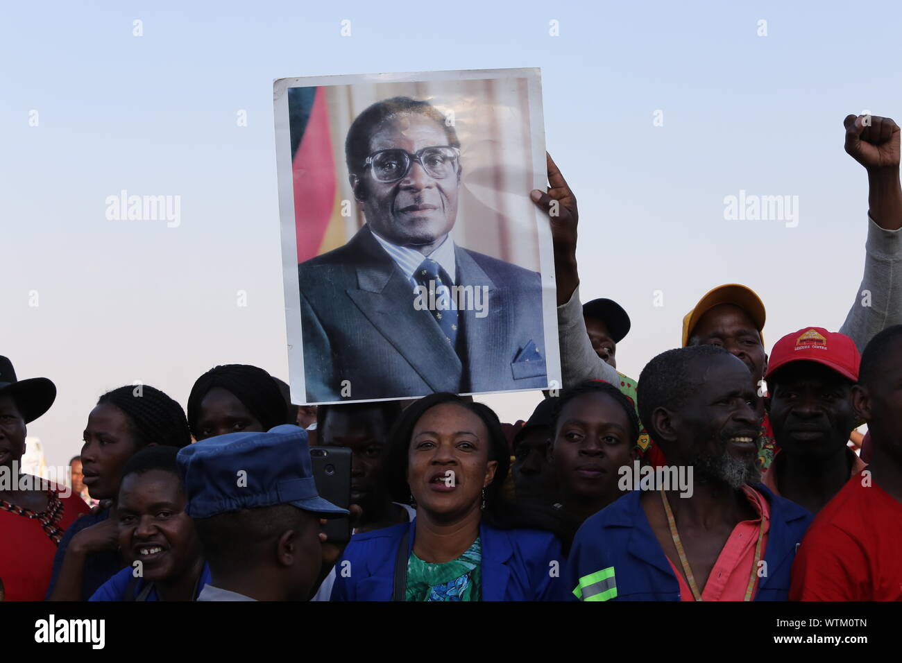 Harare, Zimbabwe. 11th Sep, 2019. Zimbabweans receive the body of the late former Zimbabwean President Robert Mugabe at the Robert Gabriel Mugabe International Airport in Harare, Zimbabwe, on Sept. 11, 2019. The body of the late former Zimbabwean President Robert Mugabe, who died in Singapore last Friday aged 95, arrived in the country on Wednesday afternoon ahead of his burial planned for Sunday. Credit: Chen Yaqin/Xinhua/Alamy Live News Stock Photo