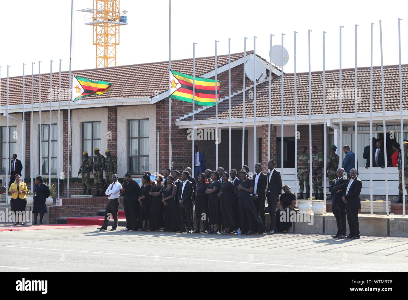 Harare, Zimbabwe. 11th Sep, 2019. Zimbabweans receive the body of the late former Zimbabwean President Robert Mugabe at the Robert Gabriel Mugabe International Airport in Harare, Zimbabwe, on Sept. 11, 2019. The body of the late former Zimbabwean President Robert Mugabe, who died in Singapore last Friday aged 95, arrived in the country on Wednesday afternoon ahead of his burial planned for Sunday. Credit: Chen Yaqin/Xinhua Stock Photo
