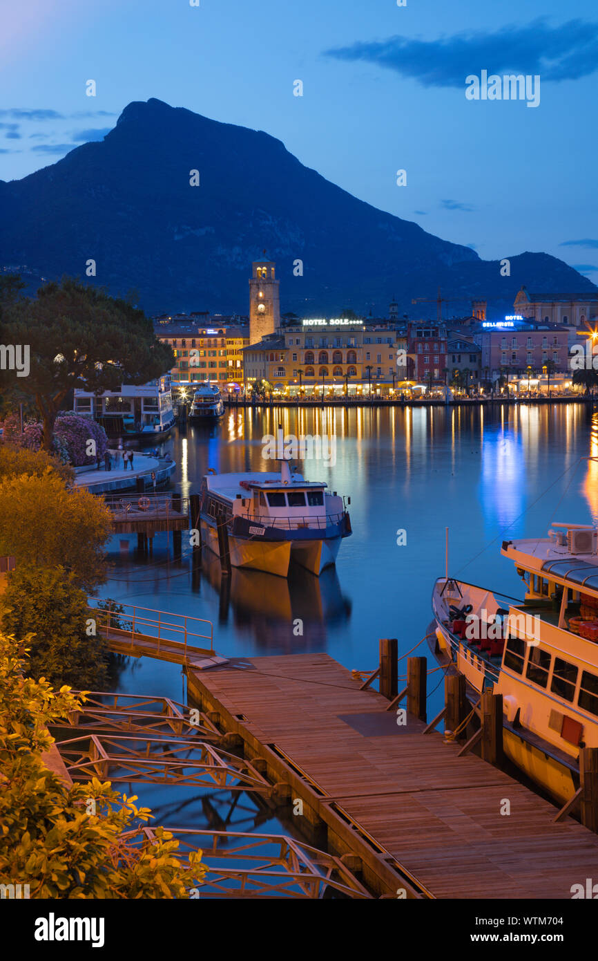 RIVA DEL GARDA, ITALY - JUNE 6, 2019: The City from south with the Alps in the backgound. Stock Photo