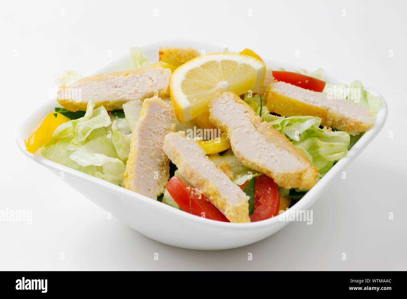 Chicken lettuce salad bowl with tomatoes, Cheese, and peppers Stock Photo - Alamy