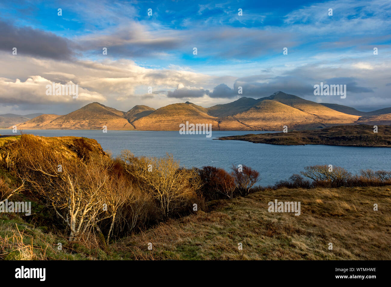 Sunset on the Ben More hills, over the island of Eorsa and Loch na Keal, Isle of Mull, Scotland, UK Stock Photo