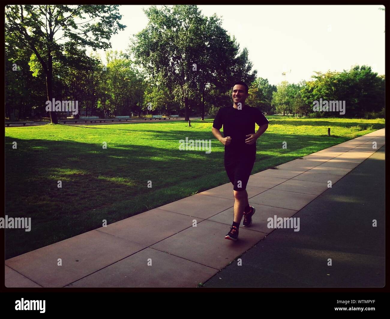 Man running park hi-res stock photography and images - Alamy