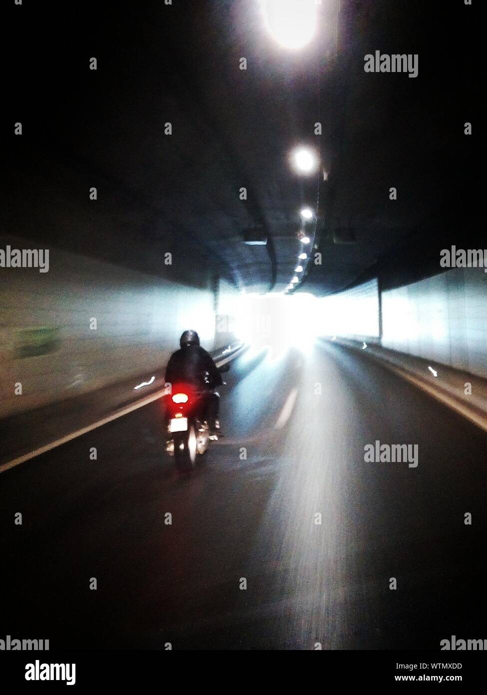 Motorcycling In Tunnel Stock Photo