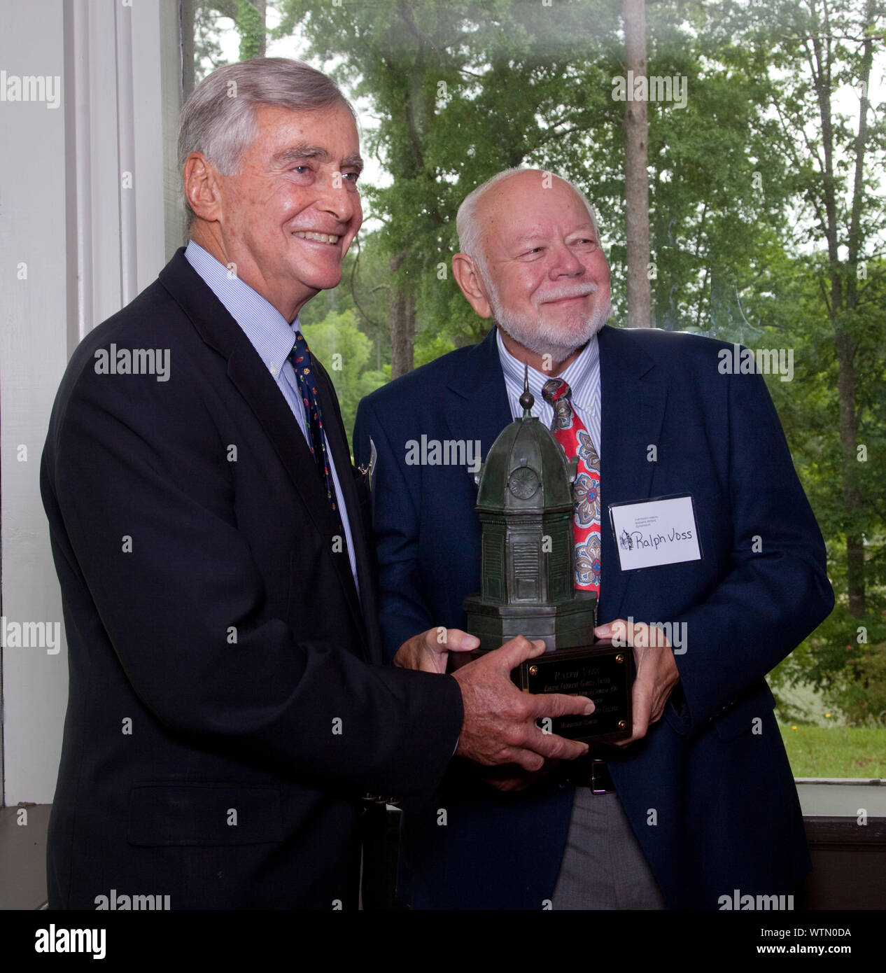 Mr. George F. Landegger and Ralph Voss speak at the podium at the 13th Annual Alabama Writers Symposium in Monroeville, Alabama Stock Photo