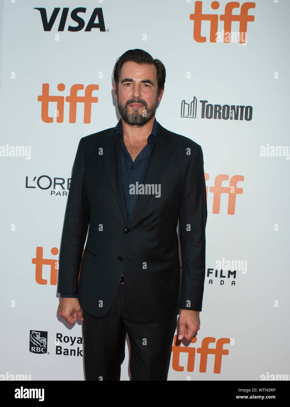 Toronto, Canada. 11th Sep, 2019. Actor Claes Bang poses for photos before the North American premiere of the film "The Burnt Orange Heresy" at Roy Thomson Hall during the 2019 Toronto International Film Festival (TIFF) in Toronto, Canada, on Sept. 11, 2019. Credit: Zou Zheng/Xinhua Stock Photo