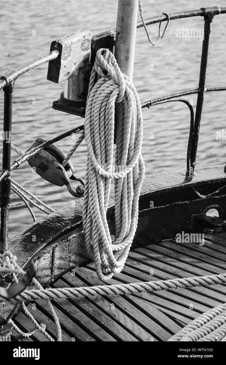 Rope Hanging On Boat Railing By Lake Stock Photo Alamy