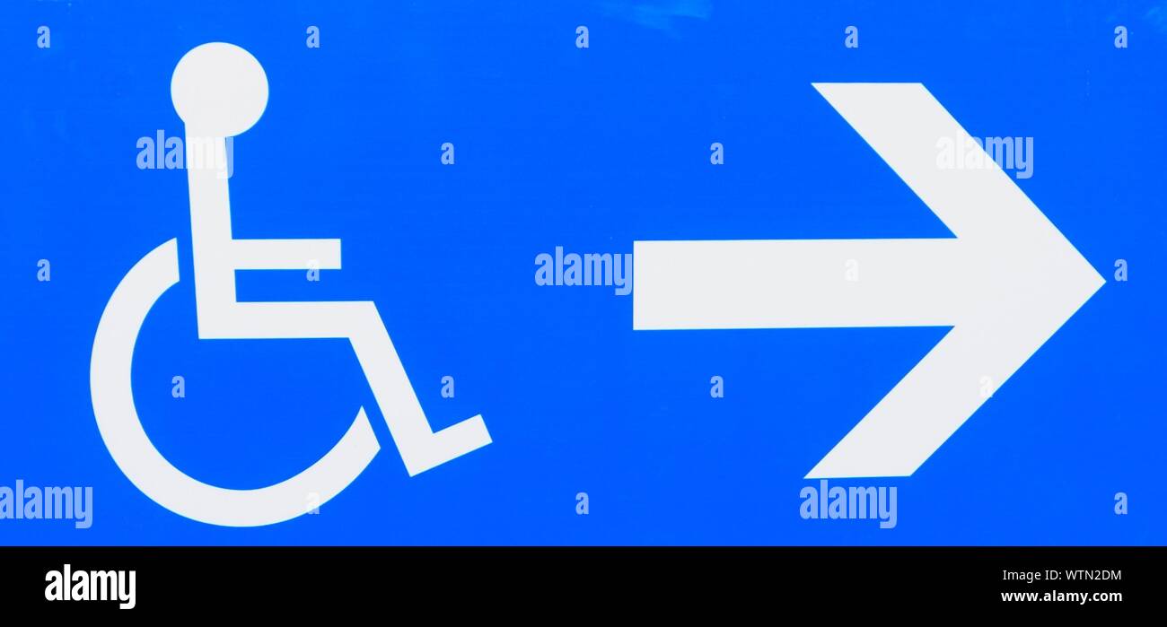 Close-up Of Disabled Parking Sign Stock Photo