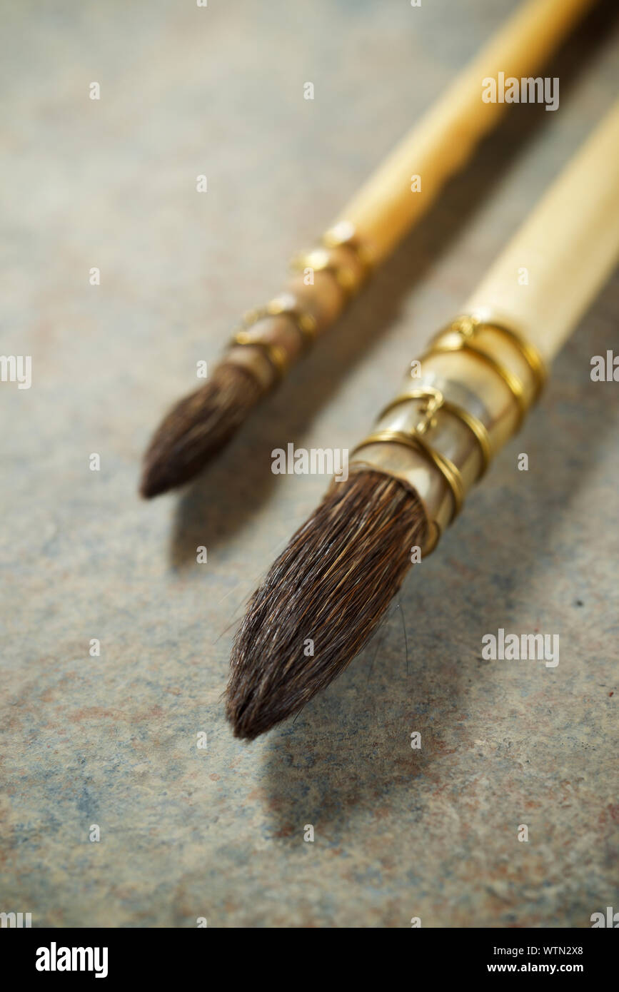 Paintbrushes on a table Stock Photo Alamy