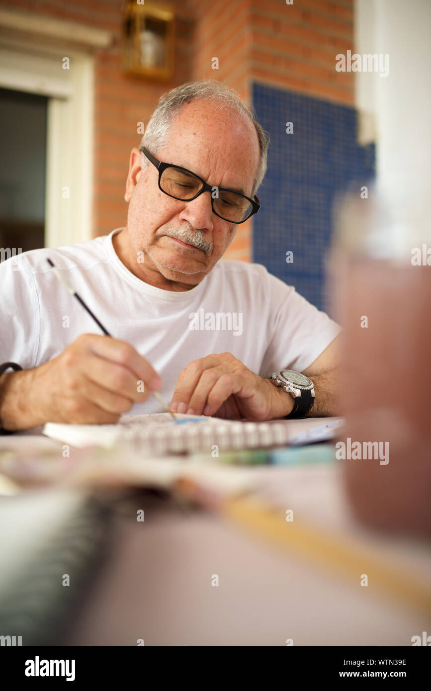 Senior hand painting hi-res stock photography and images - Alamy