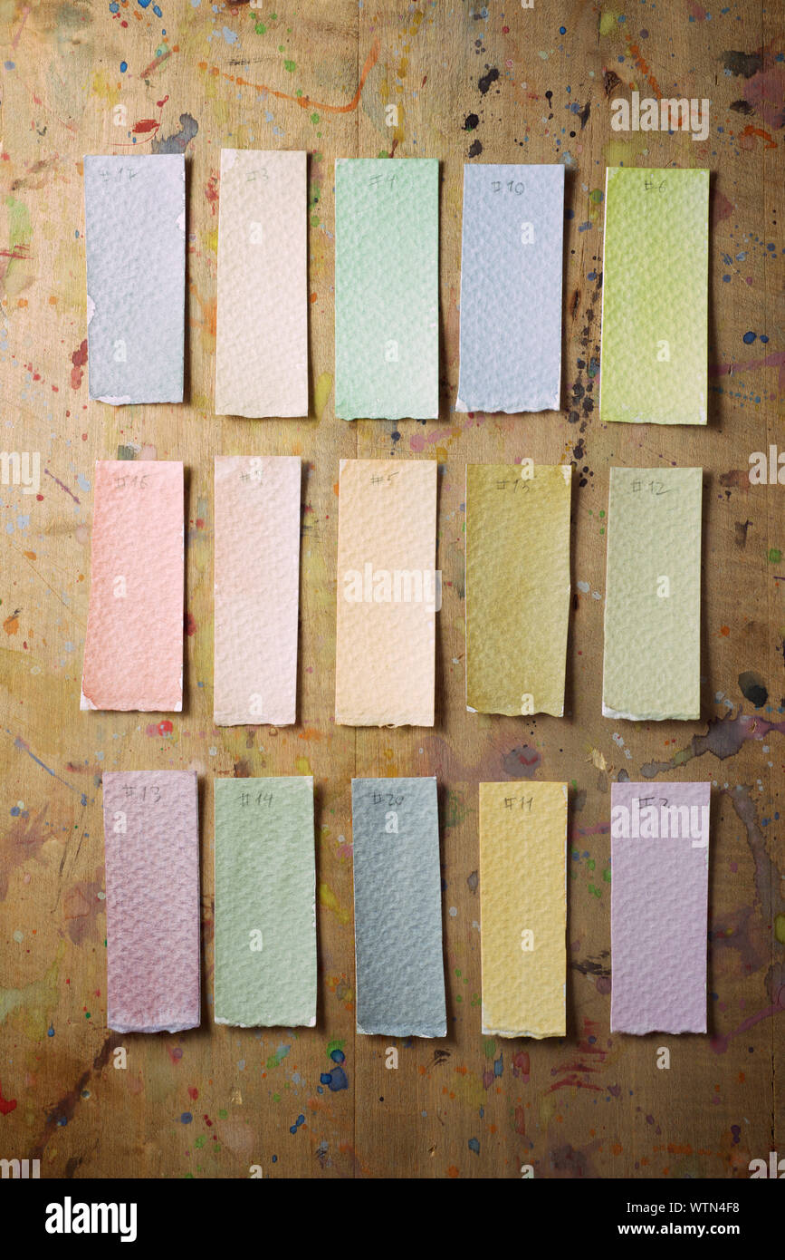 Watercolor test cards on a table. Stock Photo