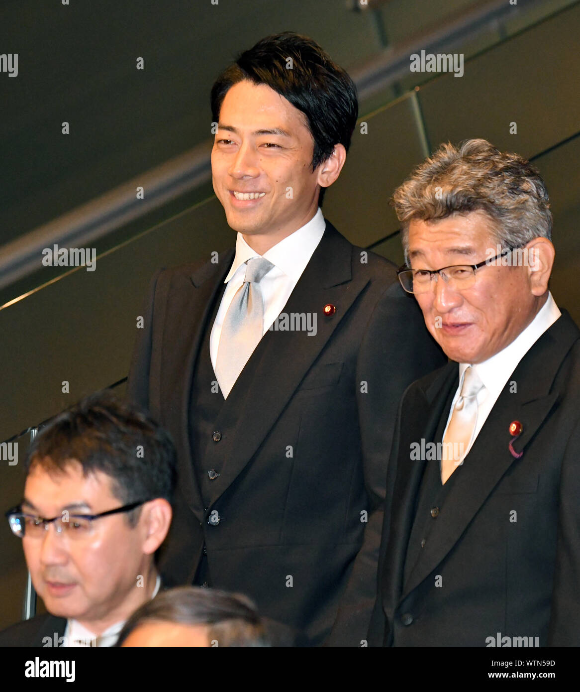 Tokyo, Japan. 11th Sep, 2019. Shinjiro Koizumi, left, newly-appointed environment minister, cannot be any happier as the 38-year-old son of Japan's former Prime Minister Junichiro Koizumi joins other members of Prime Minister Shinzo Abes new Cabinet in a photo call at the prime ministers office in Tokyo on Wednesday, September 11, 2019. Credit: Natsuki Sakai/AFLO/Alamy Live News Stock Photo