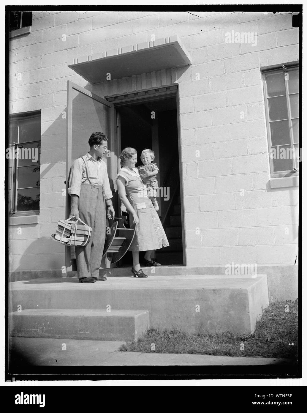 Mr. and Mrs. Irving Machiz, with their son, Edward, moving into their new quarters at Greenbelt, Resettlement Administration city, 10/2/37 Stock Photo