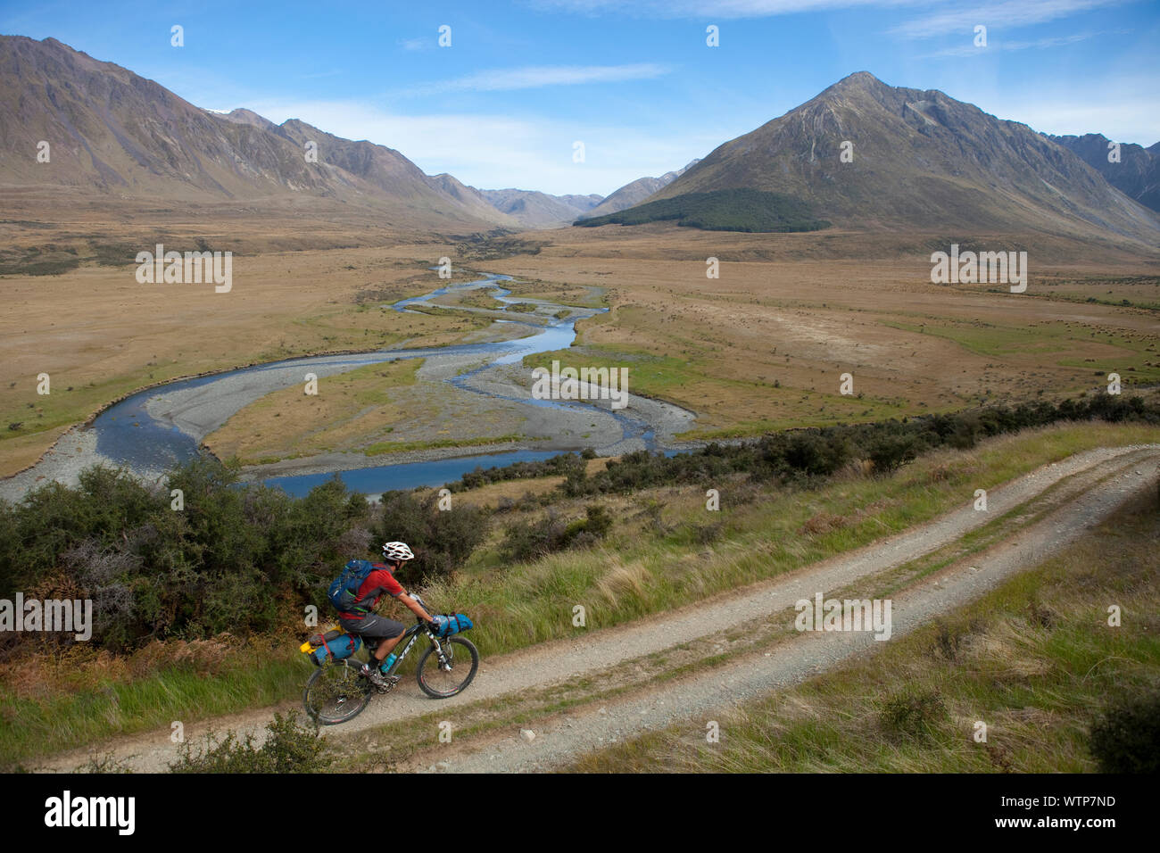 Dallas Hewett rides near the Windon Burn and Mararoa River confluence, Southland, New Zealand. Stock Photo