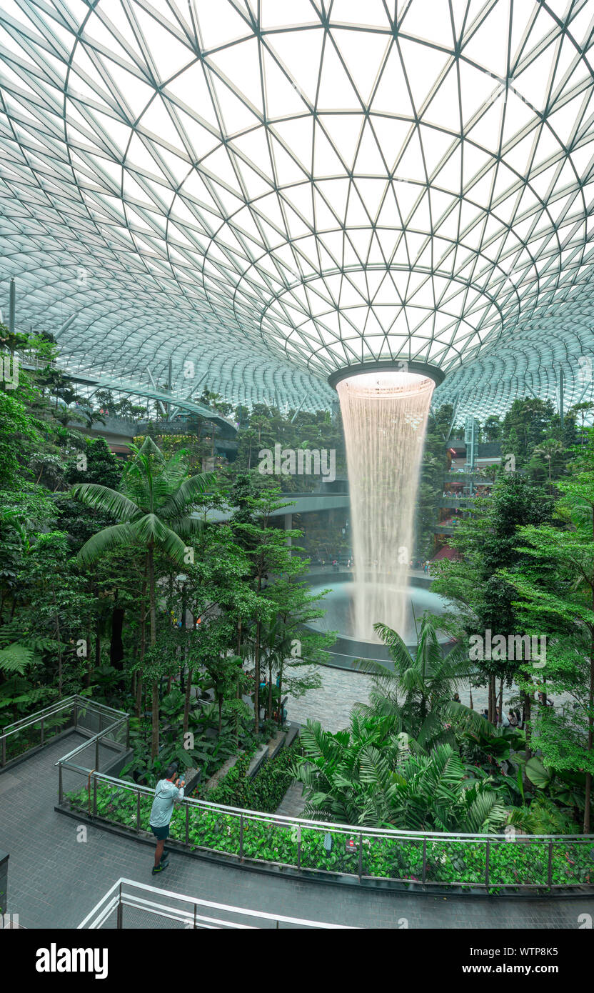 The Jewel Changi is the last architectural addition to the Singapore airport, with a record-high indoor rain vortex waterfall, a vertical tropical for Stock Photo