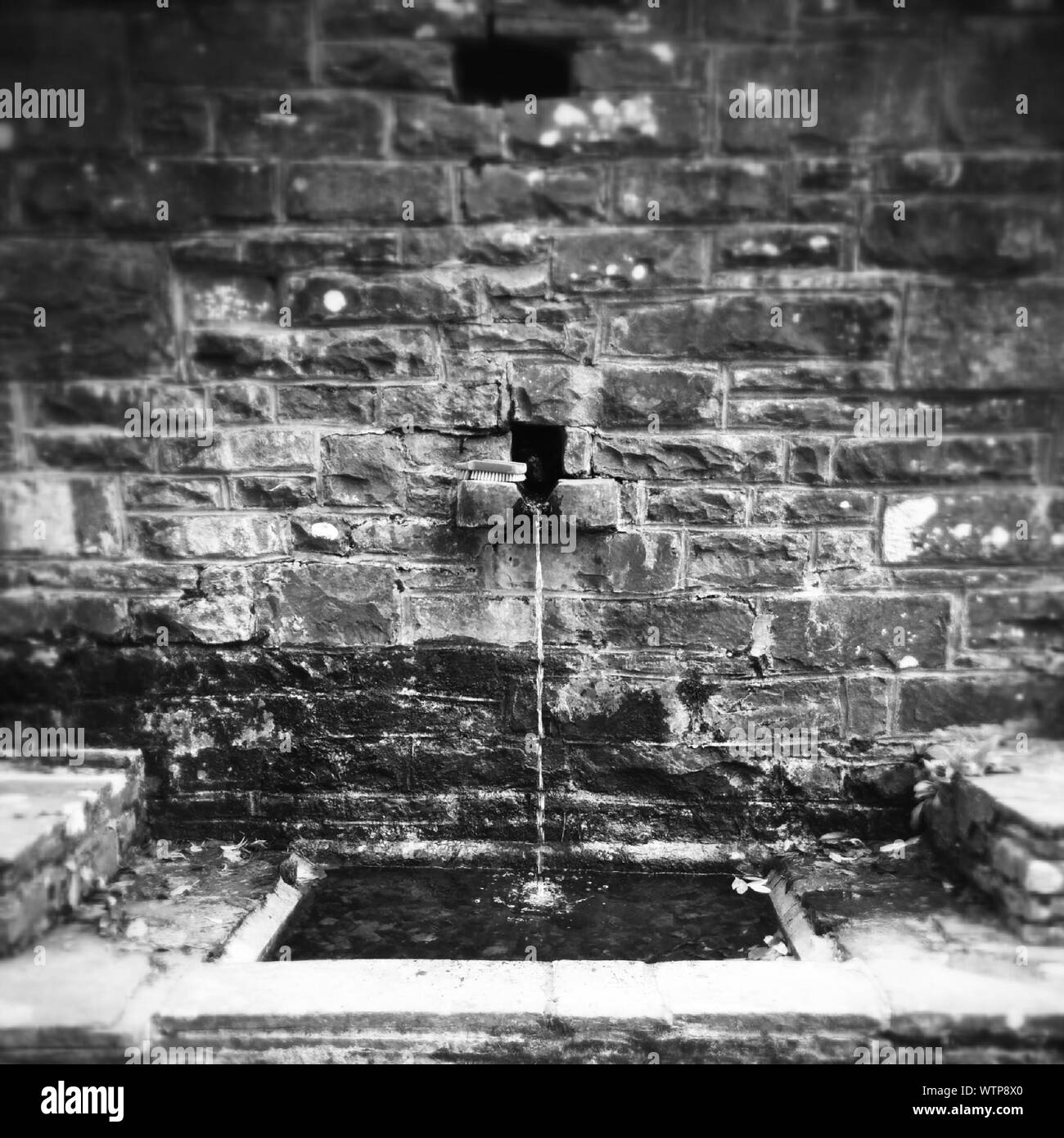Stone Fountain With Running Water Stock Photo Alamy
