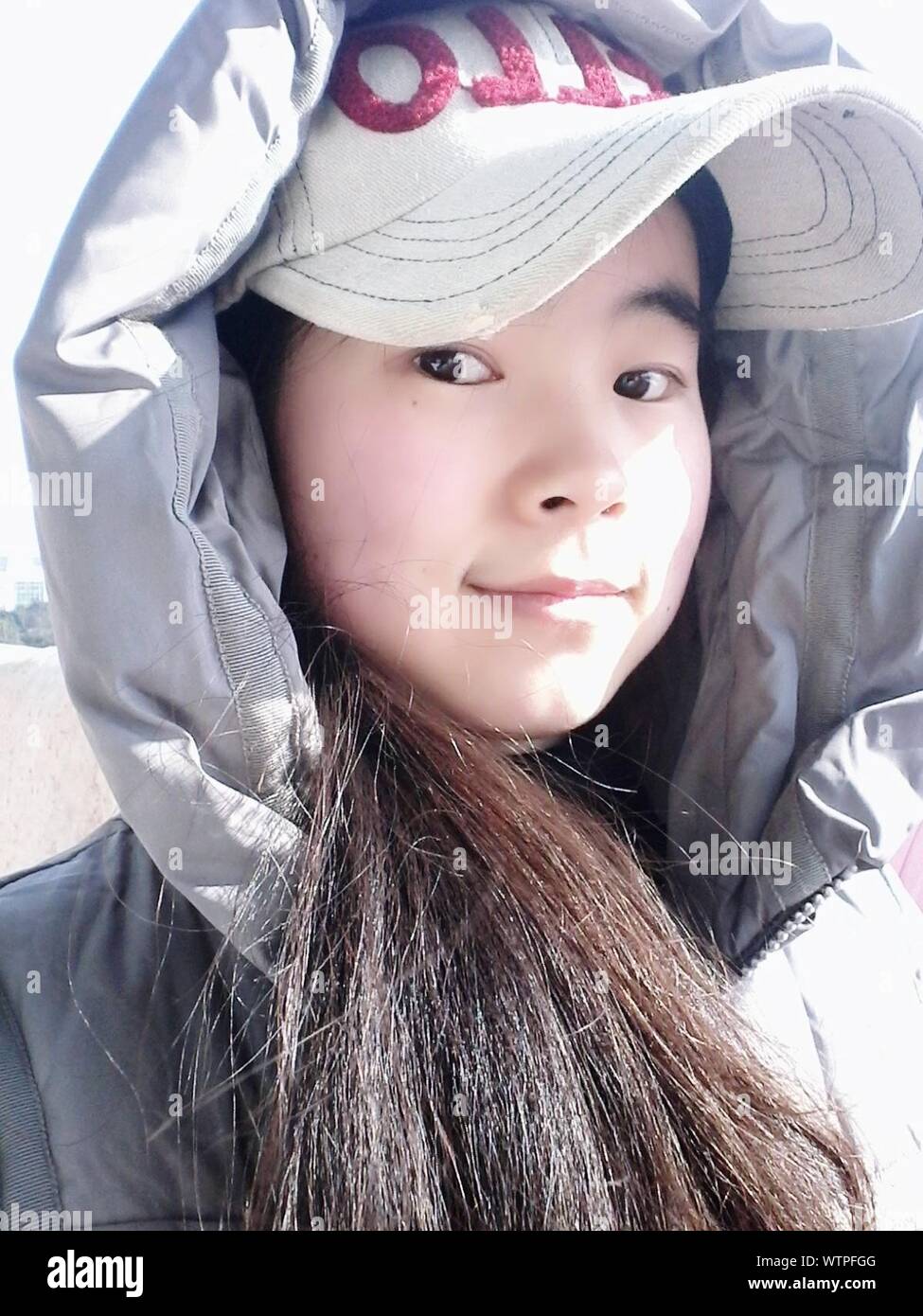 Portrait Of Teenage Girl In Cap And Jacket Stock Photo Alamy