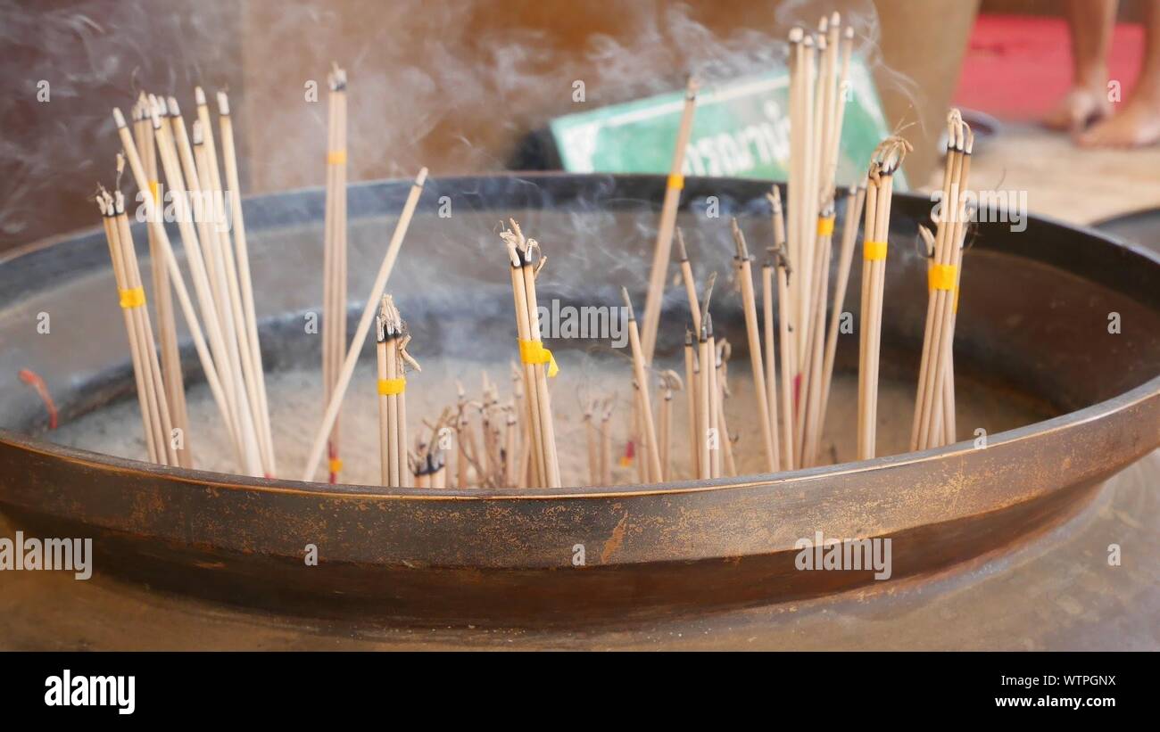 Closeup Of Incense Sticks Burning In Container Stock Photo Alamy